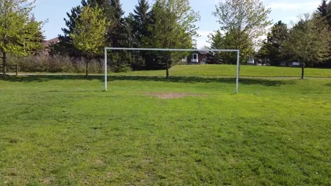 Aerial View 4K  pull back on a soccer field Stock Footage 154459481