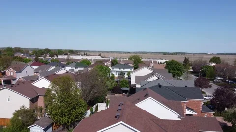 Aerial View 4K pull back over an empty soccer field, to suburbs Stock Footage 154459709