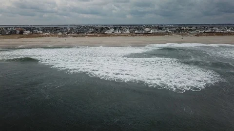 Aerial View 4K - Seaside Park Over Ocean Waves - Stationary Stock Footage 124032004