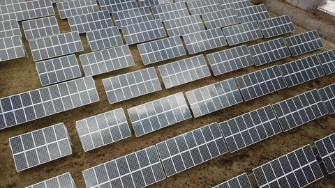Aerial View 4K - Solar Panel Farm - Medium Altitude Rotate Stock Footage 124447779