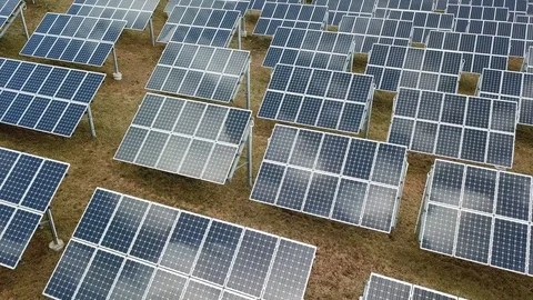 Aerial View 4K - Solar Panel Farm - Left Movement with Cloud Reflections Stock Footage 124447792