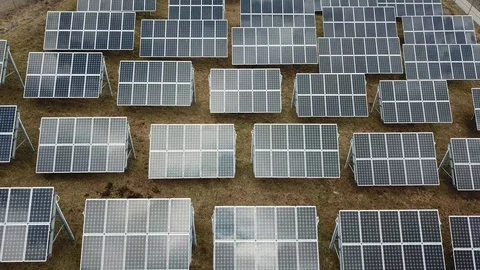 Aerial View 4K - Solar Panel Farm - Backwards Straight Stock Footage 124448120