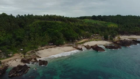 Aerial view 4K of steep cliffs on Bali beach Stock Footage 289759780
