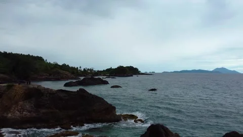 Aerial view 4K of steep cliffs on Bali beach Stock Footage 289759802