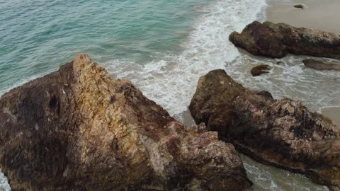 Aerial view 4K of steep cliffs on Bali beach Stock Footage 289759954