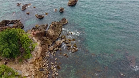 Aerial view 4K of steep cliffs on Bali beach Stock Footage 289760222