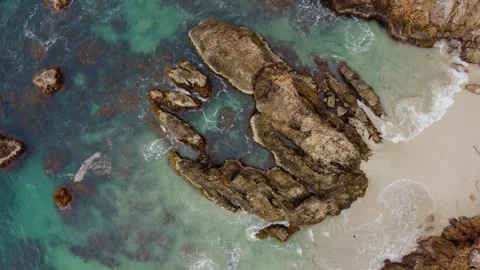 Aerial view 4K of steep cliffs on Bali beach Stock Footage 289760231