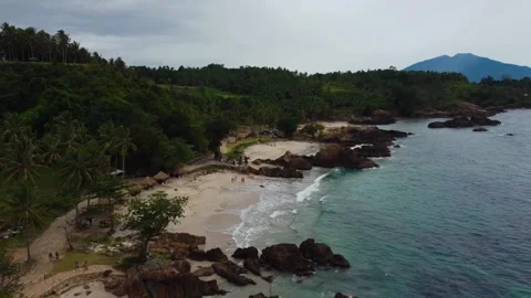 Aerial view 4K of steep cliffs on Bali beach Stock Footage 289760478