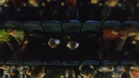 Aerial view, 4K. Video frames at the cinema with funny kids, who watch cartoon Stock Footage 76005971