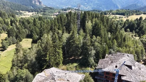 Aerial view of 5G cell tower and abandoned building construction site in green m 動画素材 342713377