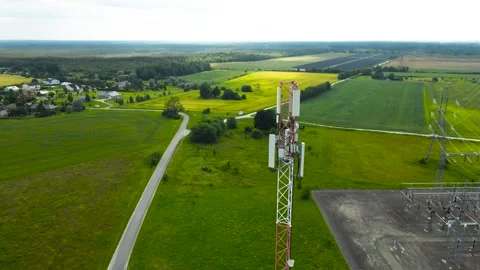 Aerial View of a 5G or 6G Telecommunications Tower and Electrical Substation Stock Footage 340237200
