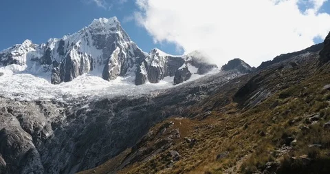 An aerial view of a 6000m mountain in the peruvian andes. Stock Footage