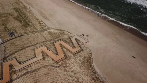 Aerial View 60fps - Beach Path Zigzag - Revolve Stock Footage 118002580