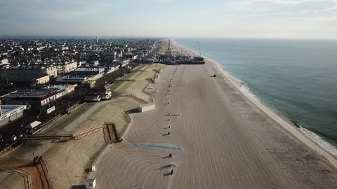 Aerial View 60fps - Ocean Waves in Seaside Heights at Casino Pier - Stationary Stock Footage 114450604