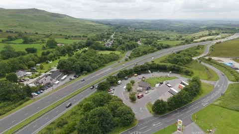 Aerial view of the A30 at the A386 turn off in Devon, showing traffic and Stock Footage 279139181