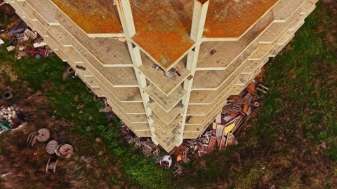 Aerial view of abandoned building surrounded by overgrown vegetation Stock Footage 324520869