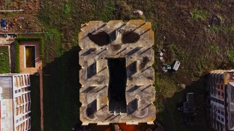 Aerial view of abandoned building surrounded by overgrown land Stock Footage 325085271