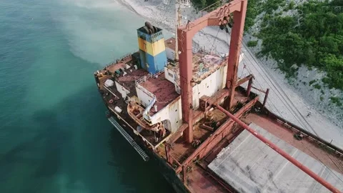 Aerial view of abandoned cargo ship. Bulk carrier ran aground after the storm Stock Footage 223535480