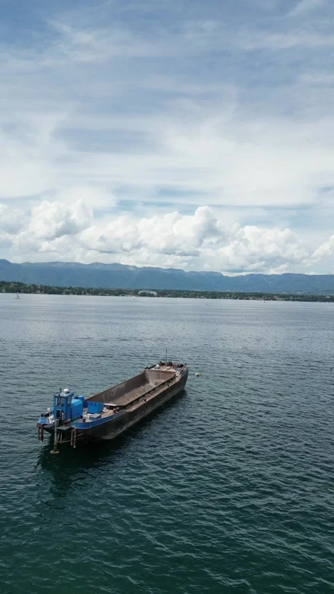 Aerial View of an Abandoned Cargo Ship on Lake Geneva Stock Footage 296480415