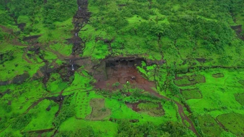 Aerial View of an Abandoned Cave in Lush Green Mountains During Monsoon Видео 342701502