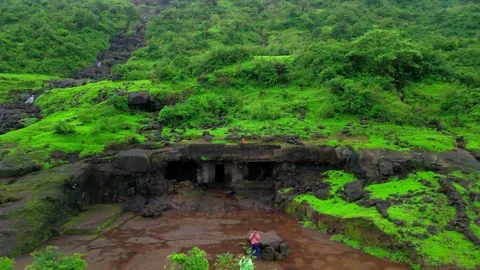Aerial View of an Abandoned Cave in Lush Green Mountains During Monsoon Stock Footage 342701522