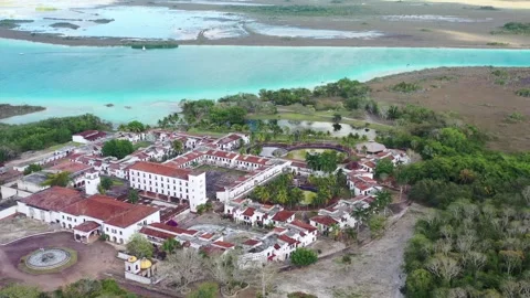 Aerial View of the Abandoned Ghost Hotel in the Lagoon of Seven Colors in 動画素材 333805351