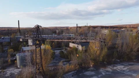 Aerial view of abandoned industrial loading area with tower crane. Stock Footage 235688302