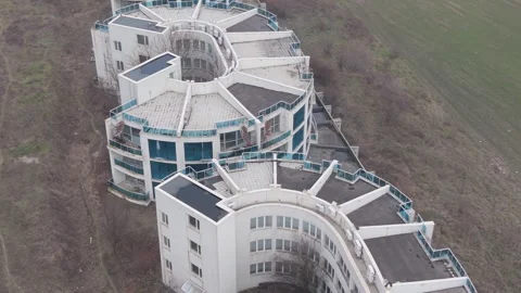 Aerial view of abandoned modern buildings surrounded by empty countryside land Stock Footage 328828860