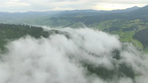 Aerial view above the clouds in the mountains Stock Footage 67204211