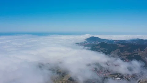 Aerial view above clouds of vineyard covered hills v2 Stock Footage 119570735