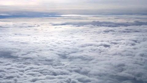 Aerial view above cloudscape. White fluffy clouds in sky, top view Stock Footage 123766110
