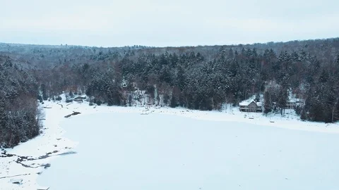Aerial view above Eagle Lake on a cold winter day, Ontario, Canada Stock Footage 99990185