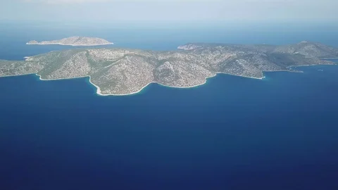 Aerial view from above of a group of solitary islands in the mediterranean sea Stock Footage