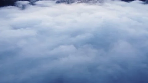 Aerial view from above of inverted clouds in the light of the morning sun Stock Footage 201165133