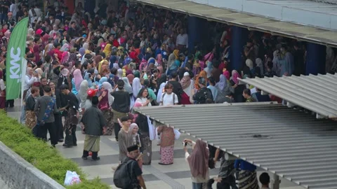 Aerial view above Keretapi Sarong participants at train station at day Stock Footage 347048009