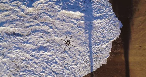 Aerial view from above of large drone hovering on sunny day Stock Footage 87188539
