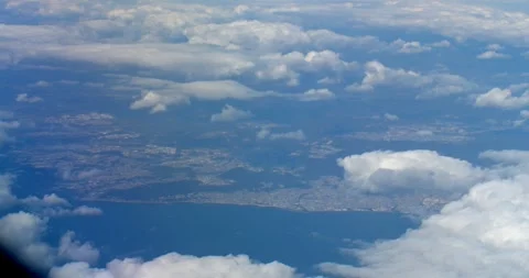 An aerial view above many clouds.Aerial view from airplane window. Stock Footage 258849535