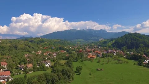 Aerial view from above over small village in mountains Stock Footage 84828108