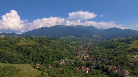 Aerial view from above over small village in mountains 스톡 동영상 84828471