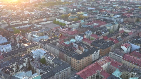 Aerial view from above of rooftops &amp; symmetrical city blocks in Stockholm City Stock Footage 132452441