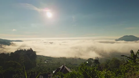 Aerial View Above Sea of Clouds With Gunung Batur Rising Beyond Morning Mist Und Stock Footage 337019834