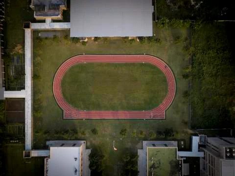 Aerial view above small running track Stock Photos