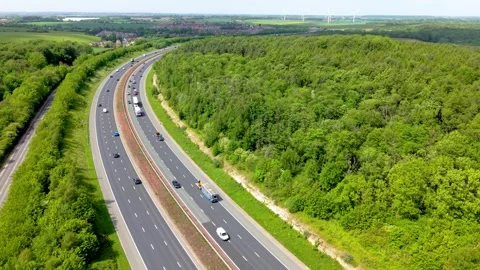 Aerial view above speeding traffic on a UK motorway Stock Footage 339285249