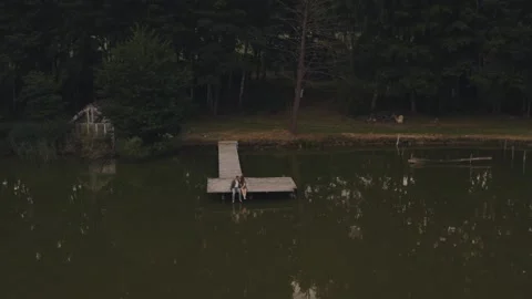 Aerial view above summer river nature and couple of young handsome European Stock Footage 312567245