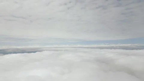 Aerial View Above Thick Cloud Blanket With Blue Sky Stock Footage 318175718