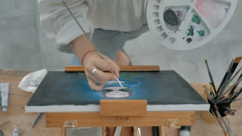 Aerial view from above of young painter hand with white blouse 스톡 동영상 130617327
