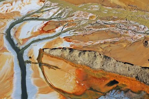 Aerial view of abstract mining pattern, nature pollution, colorful decantin.. Stock Photos