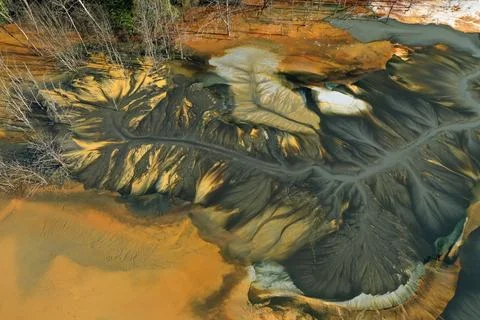 Aerial view of abstract mining pattern, nature pollution, colorful decantin.. Stock Photos