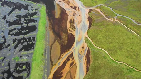 Aerial view of the abstract pattern from a river along the coastline in Iceland. Stock Footage 242320111