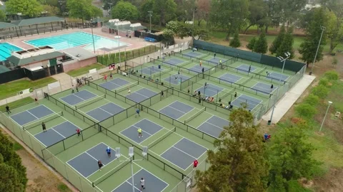 Aerial View Of Active Adults playing Pickelball On Courts Stock Footage 145883320